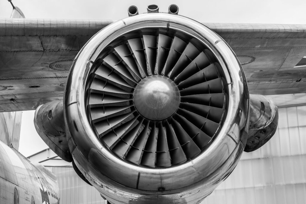 pexels-photo-459402-459402 Detailed view of a jet engine in monochrome, showcasing aviation technology.